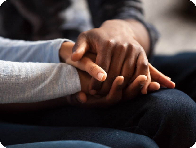 A close up of Two women holding hands