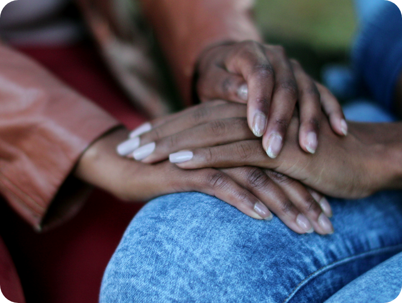 A close up of Two women holding hands